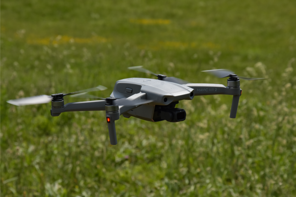 Drone flying over a field