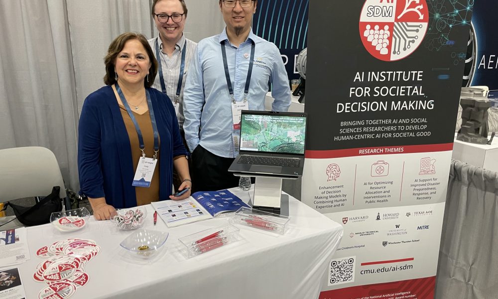 AI-SDM booth at the 2025 ai+expo in Washington, D.C. June 2-4. Pictured from left to right: Coty Gonzalez, AI-SDM Co-Director; Parker Werns, AI-SDM Project Coordinator; and Jianyu Xu, Postdoctoral Research Associate. (Not pictured: Samsara Foubert, PhD Student.)